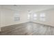 Expansive living room with luxury flooring, bright natural light, and fresh white paint at 376 Yellow Finch Ln, Henderson, NV 89012