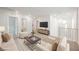 Bright and airy living space with comfortable seating, tv, and lots of natural light at 376 Yellow Finch Ln, Henderson, NV 89012