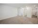 Spacious, carpeted living room with multiple doorways and ample natural light at 376 Yellow Finch Ln, Henderson, NV 89012