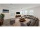 Spacious living room with neutral tones, large windows, and comfortable seating area at 376 Yellow Finch Ln, Henderson, NV 89012