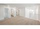 Open loft area with neutral carpet, bright light fixtures and stairway access at 376 Yellow Finch Ln, Henderson, NV 89012