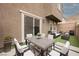 Outdoor patio area with dining set and lounge area, perfect for outdoor gatherings at 376 Yellow Finch Ln, Henderson, NV 89012