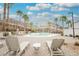 Relaxing community pool area with lounge chairs and desert landscaping, perfect for enjoying sunny days at 376 Yellow Finch Ln, Henderson, NV 89012