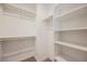 Walk-in closet offering ample storage space with built-in shelving and hanging rods at 376 Yellow Finch Ln, Henderson, NV 89012