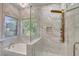 Bright bathroom features a soaking tub and a glass-enclosed shower with updated fixtures at 3794 Cape Royal St, Las Vegas, NV 89147