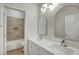 This double sink bathroom offers modern fixtures and leads to a tiled shower-tub at 3794 Cape Royal St, Las Vegas, NV 89147