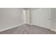 Spacious bedroom with neutral walls and carpeted floors featuring an attached ensuite at 3794 Cape Royal St, Las Vegas, NV 89147