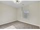 A neutral tone bedroom has carpet and base molding with a window providing natural light at 3794 Cape Royal St, Las Vegas, NV 89147
