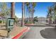 A gated community entrance is enhanced by tall palms and lush landscaping at 3794 Cape Royal St, Las Vegas, NV 89147