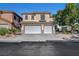 Two-story home with a three-car garage, desert landscaping, and mature shade tree at 3794 Cape Royal St, Las Vegas, NV 89147