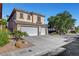 Two-story home with a three-car garage and desert landscaping at 3794 Cape Royal St, Las Vegas, NV 89147