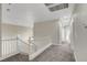 Upstairs hallway leads to multiple rooms with carpeting and white trim at 3794 Cape Royal St, Las Vegas, NV 89147