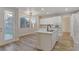 Kitchen with stainless steel appliances, a modern island, and sliding glass doors for plenty of natural light at 3794 Cape Royal St, Las Vegas, NV 89147