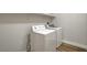 The laundry room has light wood-look floors and a white washer and dryer at 3794 Cape Royal St, Las Vegas, NV 89147