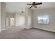 Spacious living room with neutral colors, ceiling fans, and an open layout with natural light at 3794 Cape Royal St, Las Vegas, NV 89147