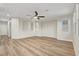 Spacious living room with wood floors, a ceiling fan, and lots of natural light from the windows at 3794 Cape Royal St, Las Vegas, NV 89147