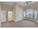 Inviting living room features plush carpet and plenty of natural light streaming through large windows at 3794 Cape Royal St, Las Vegas, NV 89147