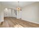 Spacious and open-concept living area with wood floors and seamless transition to foyer and staircase at 3794 Cape Royal St, Las Vegas, NV 89147