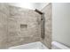 The shower features stone tiling, a built-in shelf, and a modern shower head at 3794 Cape Royal St, Las Vegas, NV 89147