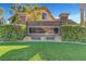 An attractive community sign is nestled among green lawns and manicured hedges at 3794 Cape Royal St, Las Vegas, NV 89147