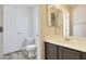 Bathroom featuring vinyl floors, vanity, and single-piece toilet at 3961 Bayamon St, Las Vegas, NV 89129