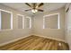 Bedroom featuring modern ceiling fan, light wood floors and neutral paint at 3961 Bayamon St, Las Vegas, NV 89129