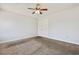 This bedroom features a ceiling fan, carpet, and a double door closet at 3961 Bayamon St, Las Vegas, NV 89129