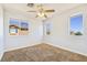 This bedroom is bright and features a ceiling fan and three nice sized windows at 3961 Bayamon St, Las Vegas, NV 89129