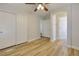 Bedroom featuring light wood floors, modern ceiling fan, and closet at 3961 Bayamon St, Las Vegas, NV 89129