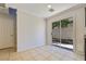 Bright dining area with tile flooring, sliding glass door and neutral paint at 3961 Bayamon St, Las Vegas, NV 89129