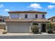 Charming two-story home featuring a well-maintained front yard, attached garage, and appealing architectural details at 3961 Bayamon St, Las Vegas, NV 89129
