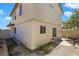 A two-story home shows backyard access with a sliding glass door and perimeter fence at 3961 Bayamon St, Las Vegas, NV 89129