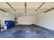 A spacious two car garage featuring an automatic door, water heater, and side door at 3961 Bayamon St, Las Vegas, NV 89129