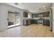 Well-appointed kitchen featuring stainless steel appliances, ample cabinet space, and access to the backyard at 3961 Bayamon St, Las Vegas, NV 89129