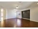 Open-concept living room with hardwood floors, recessed lighting, and large windows at 3961 Bayamon St, Las Vegas, NV 89129