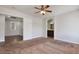 The main bedroom features carpet, a ceiling fan, and attached bathroom at 3961 Bayamon St, Las Vegas, NV 89129