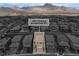 Aerial view of a neighborhood showcasing single-Gathering homes and mountain views in the distance at 397 Purple Sandpiper St, Las Vegas, NV 89138