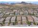 Areal view showing houses, mountain views, street access, and community layout at 397 Purple Sandpiper St, Las Vegas, NV 89138