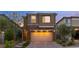 Inviting two-story home with brick accents and a spacious two-car garage at 397 Purple Sandpiper St, Las Vegas, NV 89138