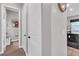 Hallway with tile flooring leading to a powder room and the main living space at 397 Purple Sandpiper St, Las Vegas, NV 89138