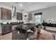 Kitchen island with dark granite countertops and dark brown cabinets, stainless steel hood at 397 Purple Sandpiper St, Las Vegas, NV 89138