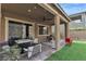 Covered patio featuring outdoor seating, dining, and outdoor cooking at 397 Purple Sandpiper St, Las Vegas, NV 89138