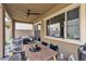 Relaxing patio with dining area, ceiling fan, and sleek furniture at 397 Purple Sandpiper St, Las Vegas, NV 89138