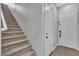 Entry hall with staircase, showing stairs leading up and doors to other rooms at 397 Purple Sandpiper St, Las Vegas, NV 89138