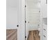 Bright bathroom with black hardware, white fixtures and an open doorway to a bedroom at 429 N 10Th St, Las Vegas, NV 89101
