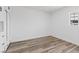 Clean bedroom with light hardwood floors, white walls and white cabinetry with black hardware at 429 N 10Th St, Las Vegas, NV 89101