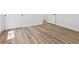 Bedroom with new light brown flooring, white walls, closet with white door, and baseboard at 429 N 10Th St, Las Vegas, NV 89101