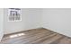 Bright, minimalist bedroom with light brown flooring and a window for natural light at 429 N 10Th St, Las Vegas, NV 89101