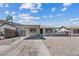 Single story home with covered parking and desert landscaping under blue skies at 429 N 10Th St, Las Vegas, NV 89101
