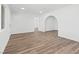 Open living room with a decorative archway and new wood flooring at 429 N 10Th St, Las Vegas, NV 89101